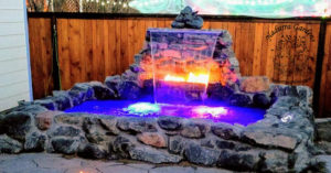 DIY hot tub with waterfall and fire feature